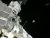 SPACE STATION COSMONAUTS TOSS SATELLITE OVERBOARD IN SPACEWALK