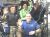 CREW MEMBERS FLEX ROBOTIC ARMS TO INSTALL STOWAGE PLATFORM