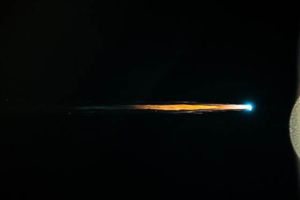 ASTRONAUTS LOOK ON AS SPACE STATION CARGO SHIP DIES A FIERY DEATH