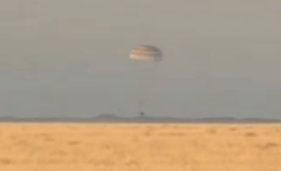 SOYUZ RETURNS TO EARTH, COMPLETING ORBITAL TORCH RELAY
