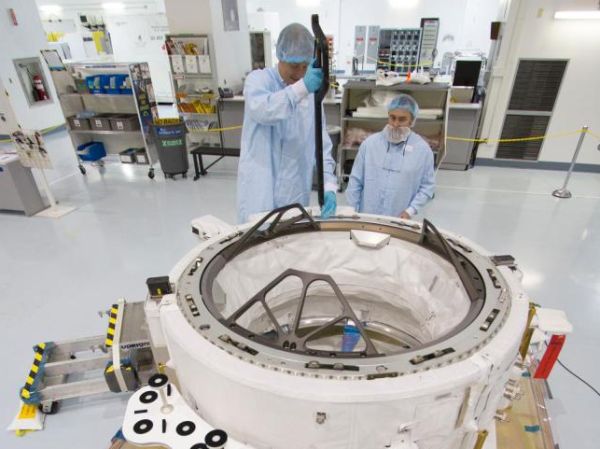SPACEX CAPSULE TO DELIVER NEW PARKING SPOT FOR SPACE STATION, RESERVED FOR FUTURE CREW SHIPS