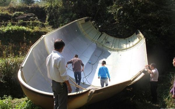 SKY IS FALLING! FARMERS WAKE UP TO PIECE OF SPACE ROCKET THAT FELL TO EARTH NARROWLY MISSING THEIR H