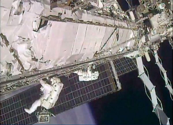 SPACEWALKING ASTRONAUTS TACKLE 'HIGH-FLYING PLUMBING' JOB ON SPACE STATION