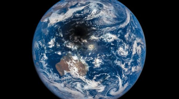 SATELLITE CAPTURES TOTAL ECLIPSE AS SEEN FROM SPACE