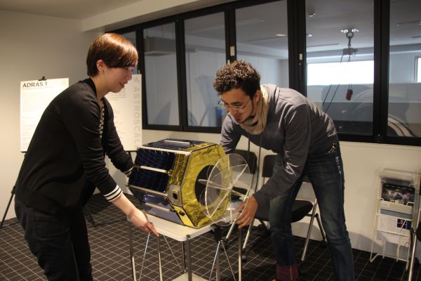 THIS SATELLITE USES SPECIAL GLUE TO STICK TO SPACE DEBRIS LIKE FLYPAPER