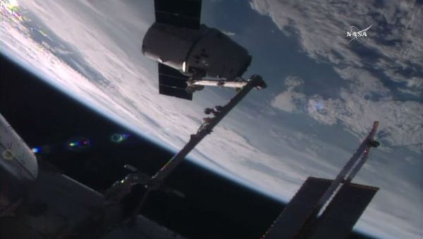 GOT IT! ASTRONAUTS CAPTURE SPACEX DRAGON SUPPLY SHIP AT SPACE STATION
