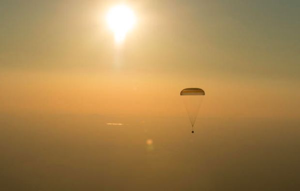STATION FLIERS RETURN TO EARTH WITH FLAWLESS LANDING