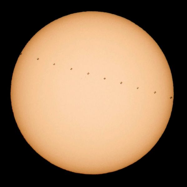 NASA PHOTOGRAPHER SEES INTERNATIONAL SPACE STATION CROSS THE SUN