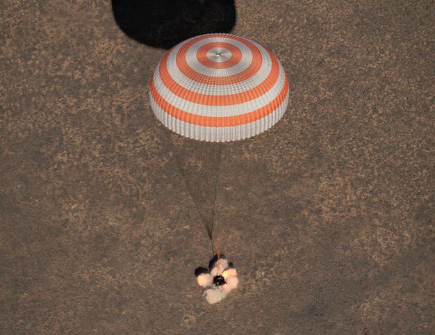 SPACE STATION CREW RETURNS TO EARTH SAFELY ON SOYUZ CAPSULE