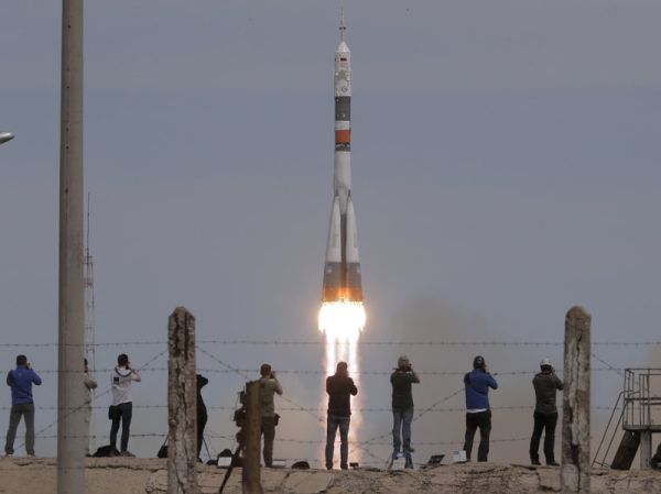 ASTRONAUT, COSMONAUT AND STUFFED DOG ARRIVE AT INTERNATIONAL SPACE STATION
