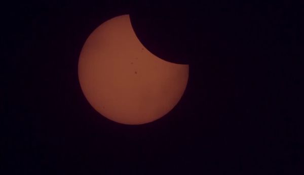 WATCH THE INTERNATIONAL SPACE STATION TRAVEL ACROSS THE SOLAR ECLIPSE