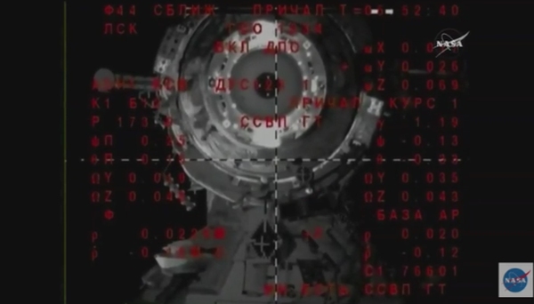 US-RUSSIAN CREW ARRIVES SPACE STATION AFTER QUICK 6-HOUR TRIP