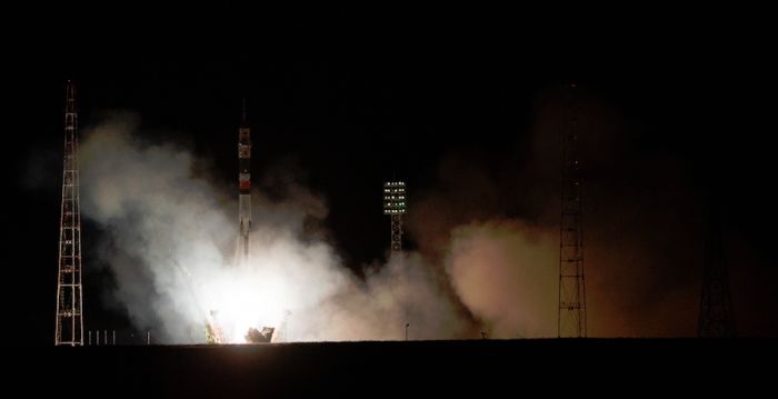 SOYUZ TAKES OFF WITH THREE BOUND FOR SPACE STATION