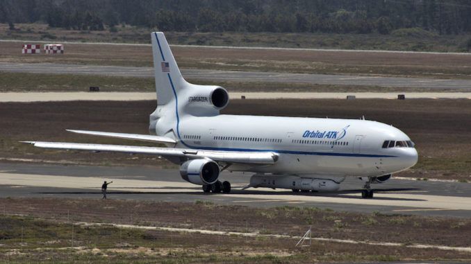 CARRIER JET WITH PEGASUS ROCKET RETURNING TO CALIFORNIA, POSTPONING NASA SATELLITE LAUNCH