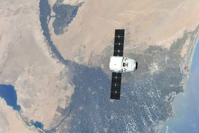 DRAGON CAPSULE REACHES SPACE STATION WITH THREE TONS OF CARGO