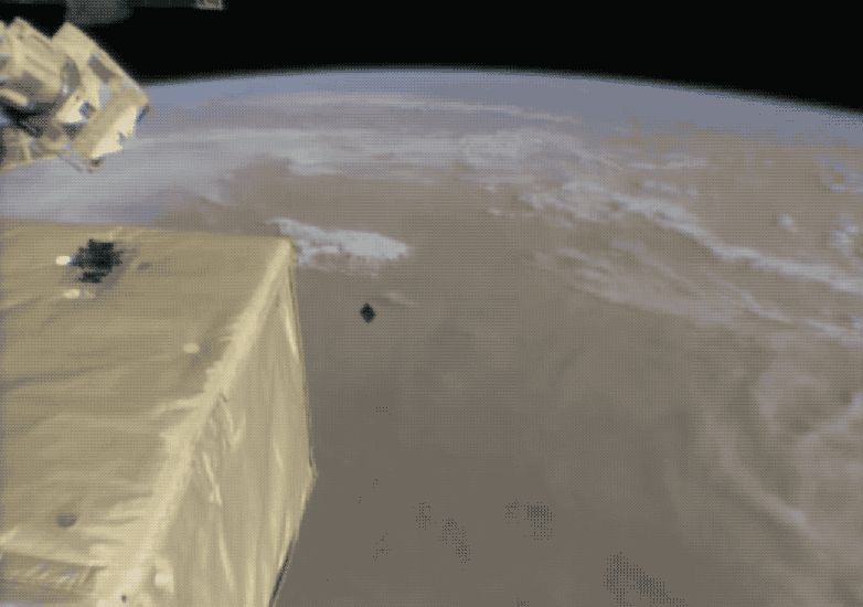WATCH THE INTERNATIONAL SPACE STATION POOP OUT A TINY SATELLITE THAT WILL SEARCH FOR MATTER