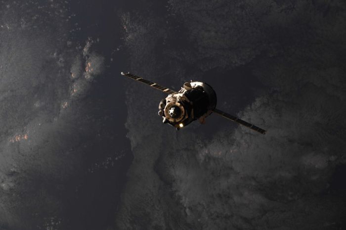 SPACE STATION CREW BACK AT SIX WITH SUCCESSFUL SOYUZ DOCKING