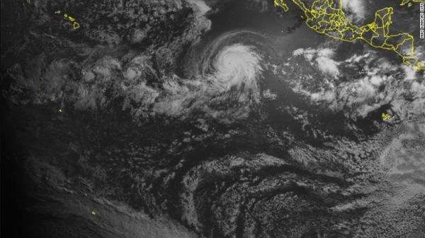 A SATELLITE CAPTURED A POWERFUL HURRICANE AND A SOLAR ECLIPSE AT THE SAME TIME