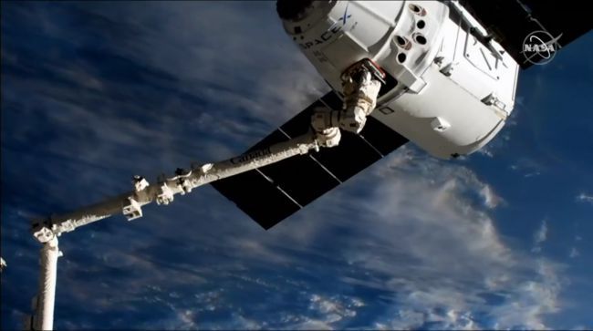 USED SPACEX DRAGON CARGO SHIP ARRIVES AT SPACE STATION FOR RECORD 3RD TIME