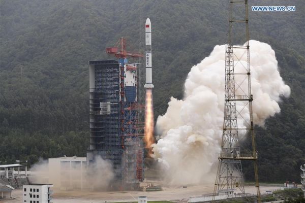 CHINA LAUNCHES THREE MILITARY SATELLITES, TESTS NEW ROCKET STEERING FINS
