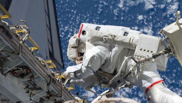 RUSSIAN COSMONAUTS CONDUCT FIRST OF 11 SPACEWALKS FOR NEW SPACE STATION MODULE