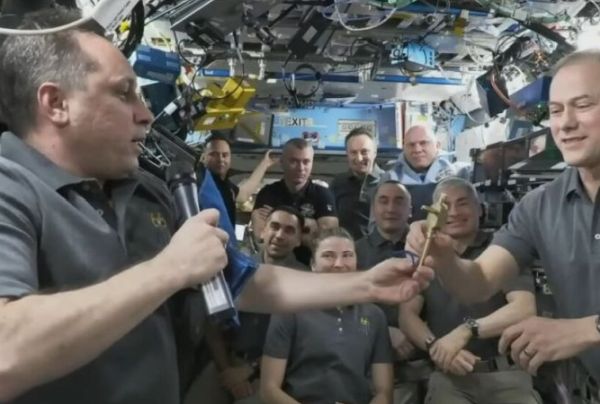 RUSSIAN COSMONAUT HANDS OVER SPACE STATION COMMAND AS NASA ASTRONAUT BIDS FAREWELL